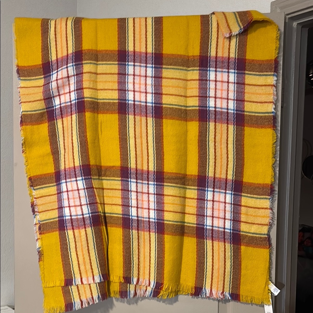 Bright yellow plaid scarf Perfect for cozying up. Adds a pop of color